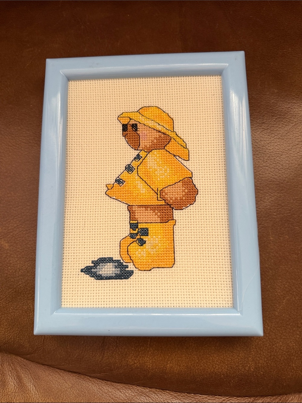Framed Yellow Raincoat Bear Cross-Stitch Wall Art
